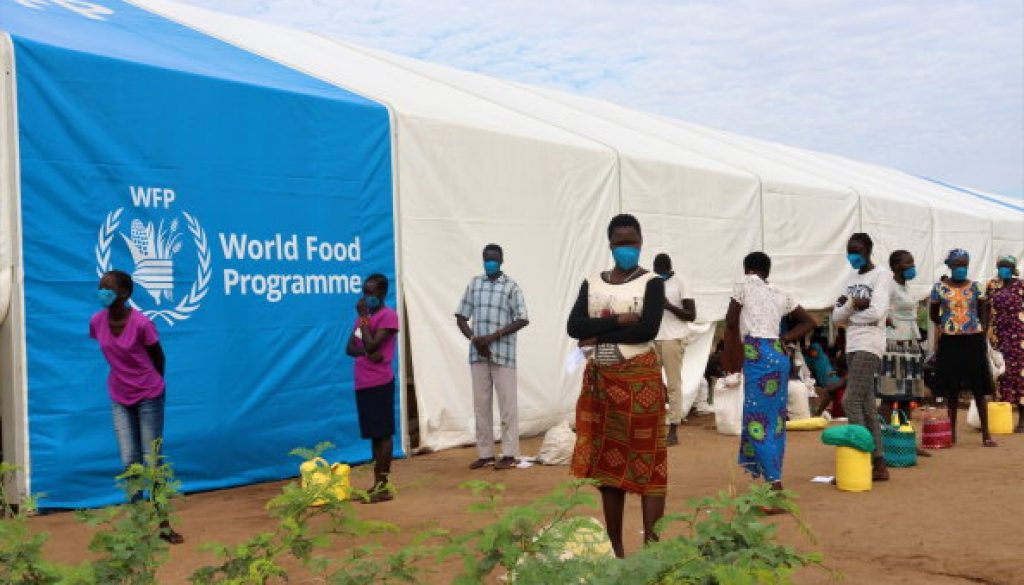 Refugees wait to collect food at a centre in Kakuma camps_Courtesy-WFP (003)